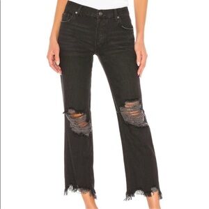 FREE PEOPLE distressed black jeans.